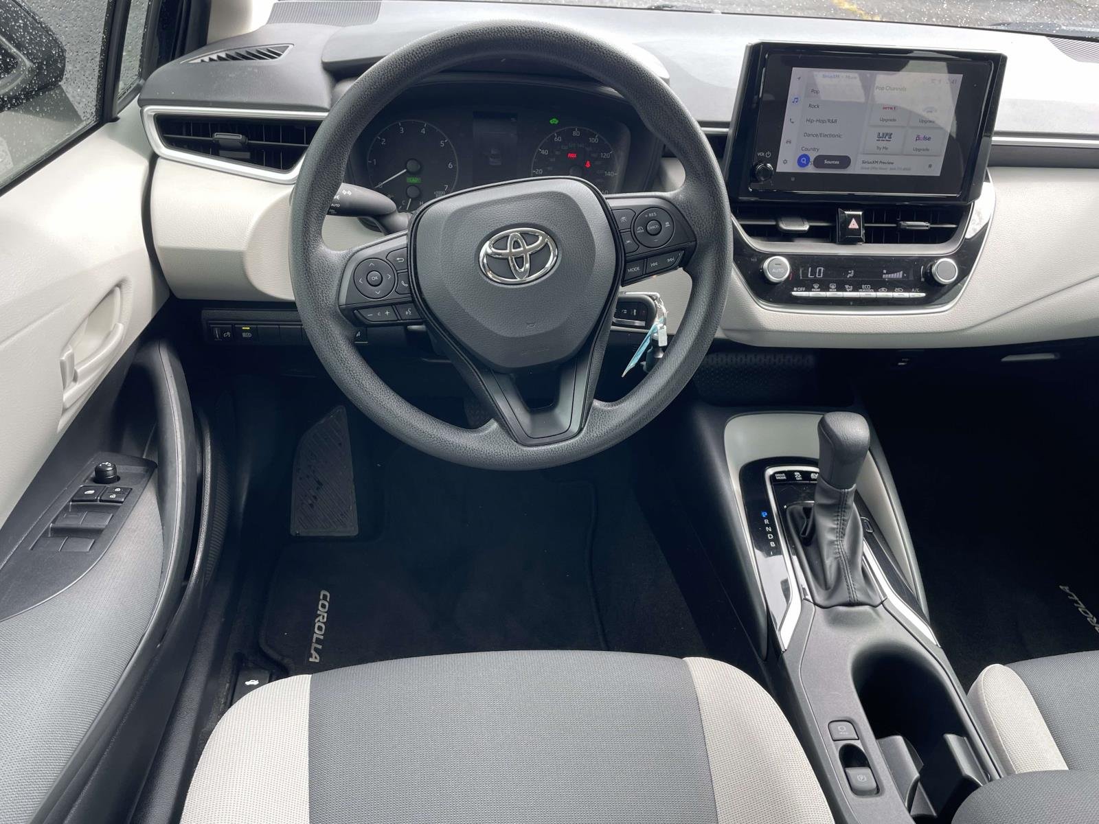 Used 2025 Midnight Black Metallic Toyota Hybrid LE image 11