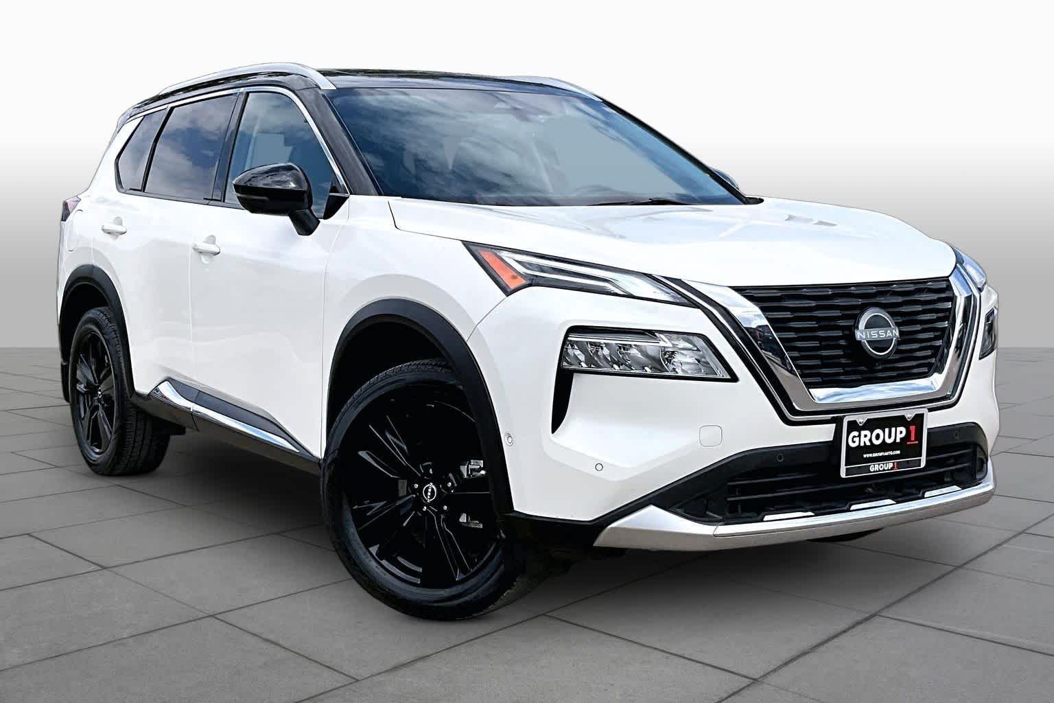 Used 2023 Pearl White Tricoat/Super Black Nissan Platinum image 2