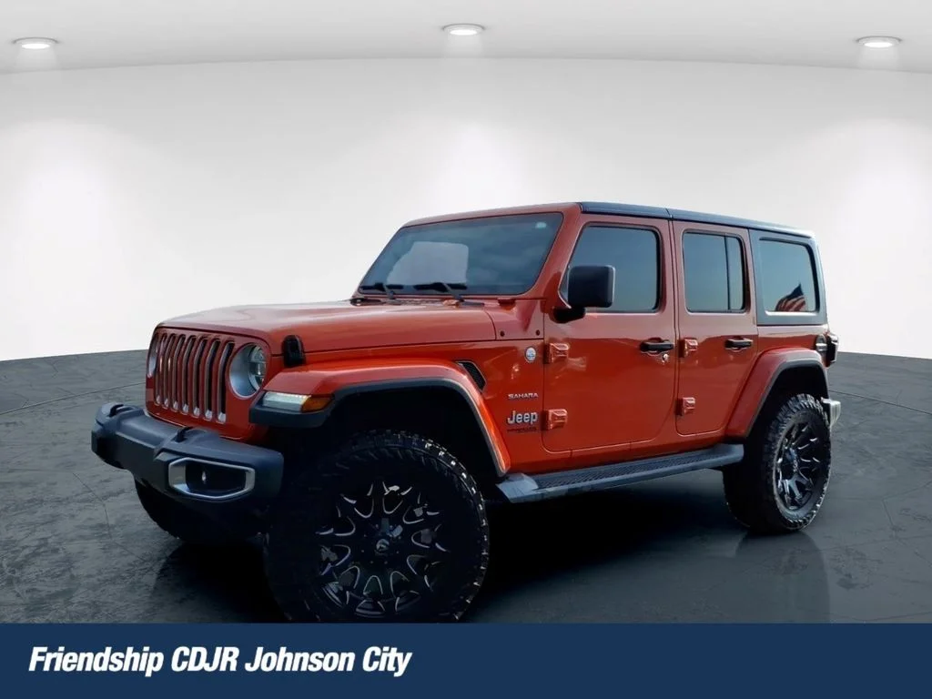 Used 2018 Orange Jeep Unlimited Sahara image 1