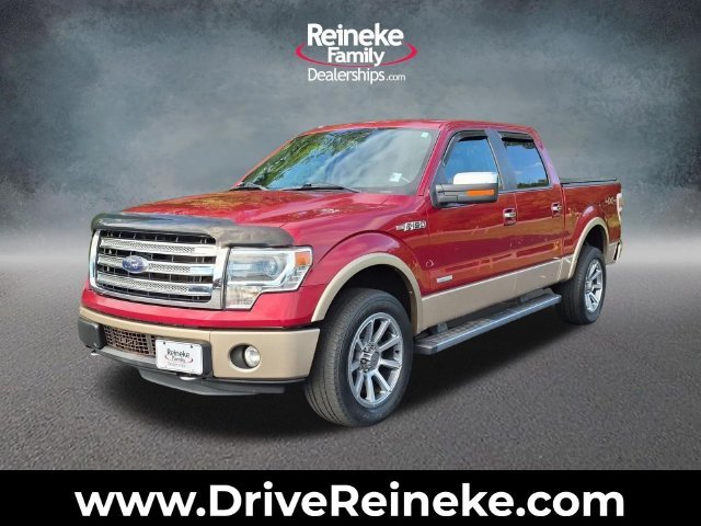 Used 2013 Ruby Red Ford Lariat image 1