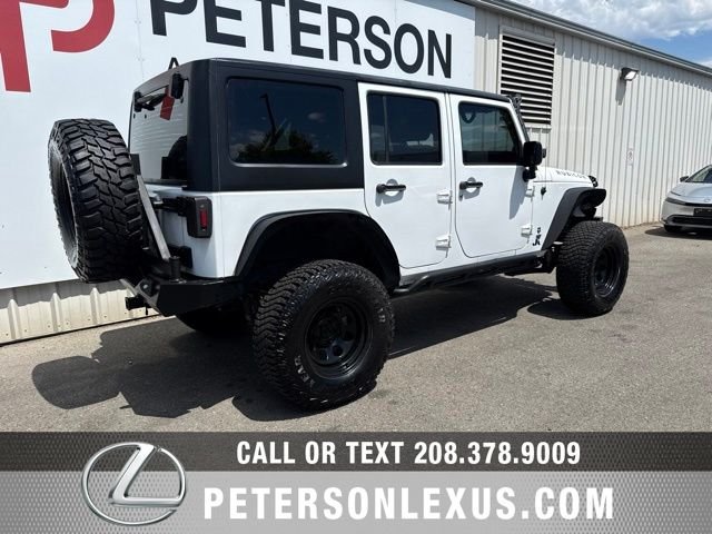 Used 2013 White Jeep Unlimited Sport image 4