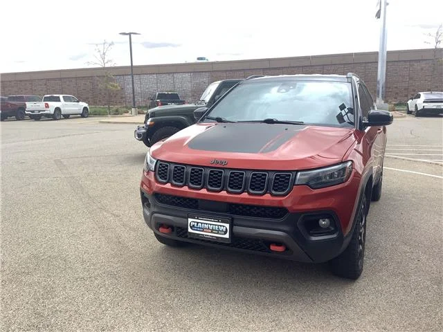 Used 2025 Red Hot Pearlcoat Jeep Trailhawk 4x4 image 1
