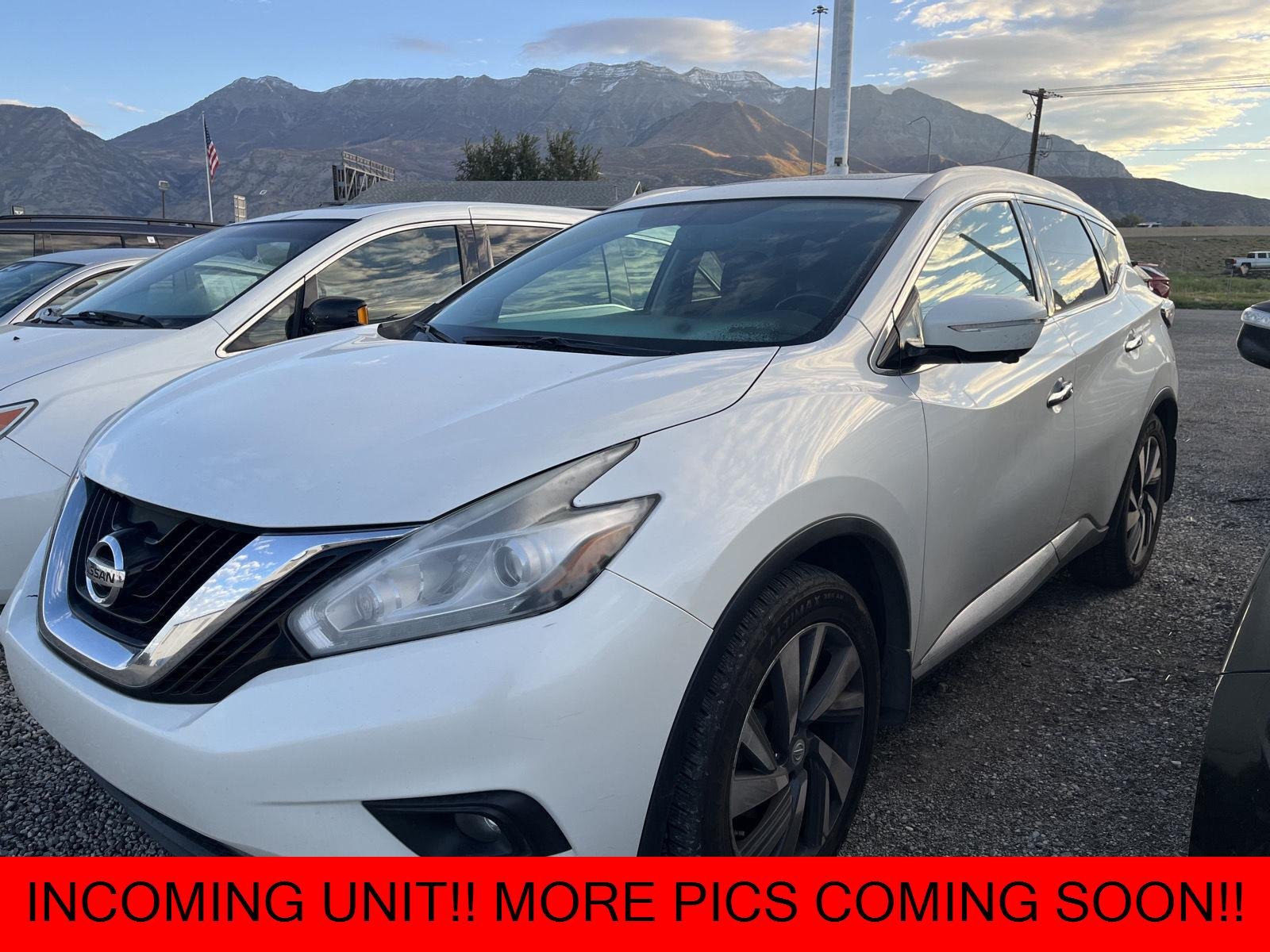 Used 2015 Pearl White Nissan Platinum image 1