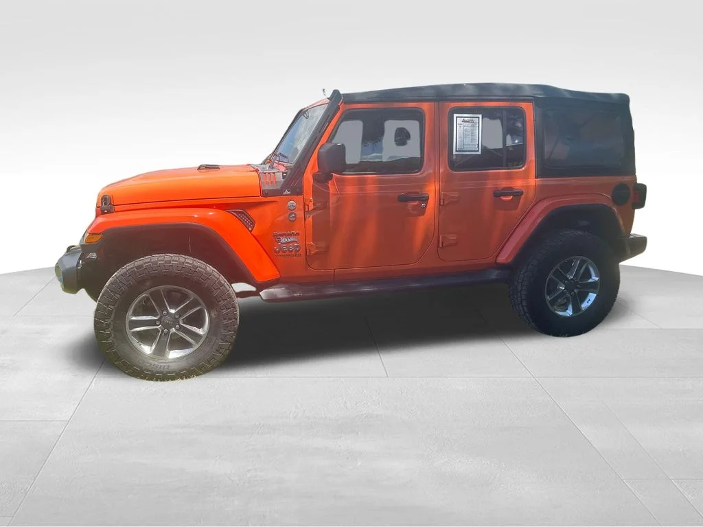 Used 2018 Orange Jeep Unlimited Sahara image 7