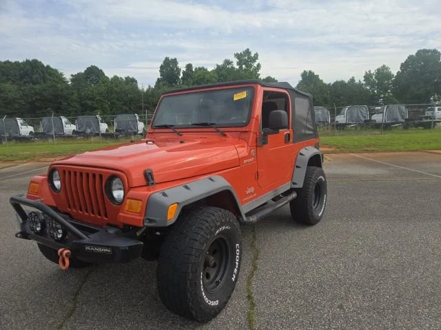 Used 2005 Impact Orange Cle Jeep Sport image 24