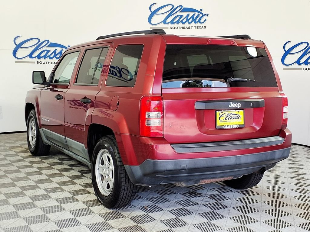 Used 2011 Deep Cherry Red Jeep Sport image 2