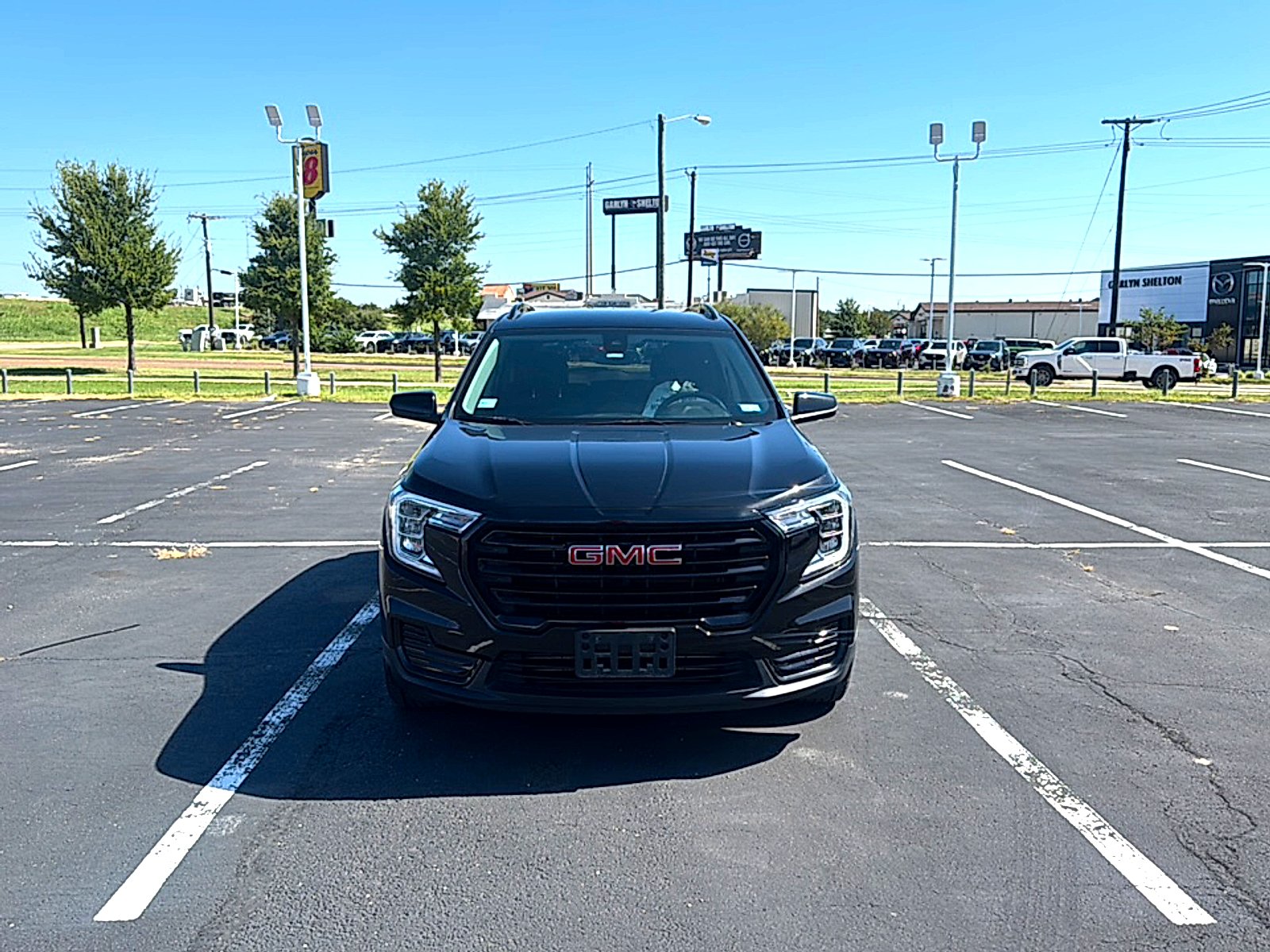 Used 2024 Ebony Twilight Metallic GMC SLE image 3