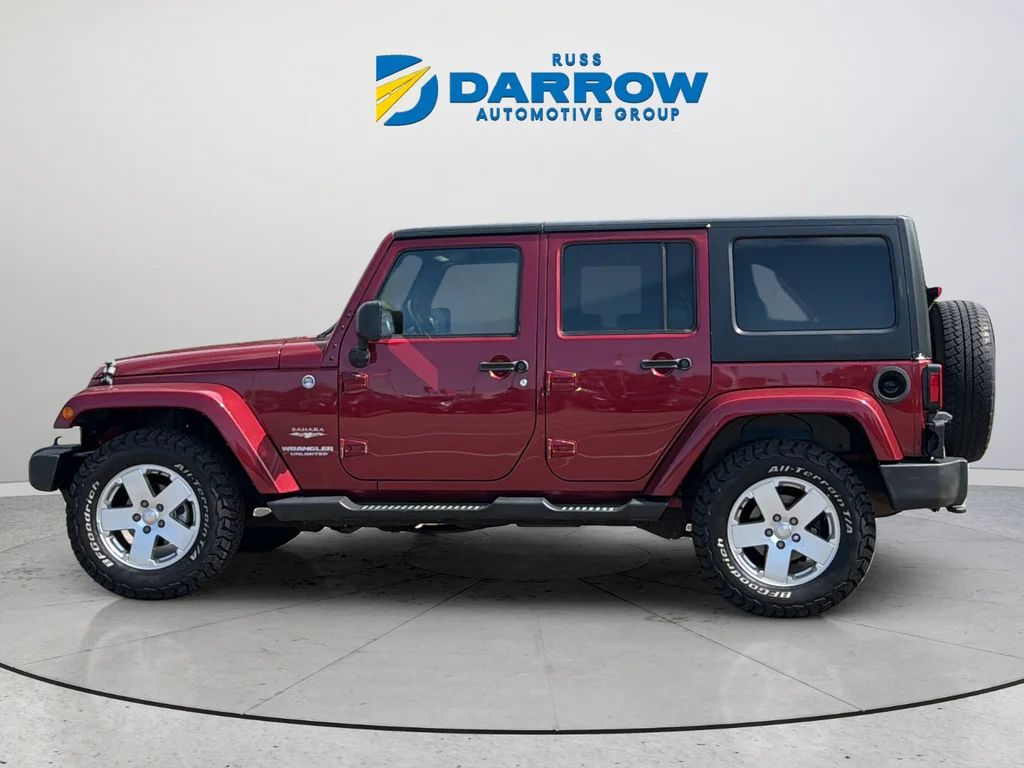 Used 2012 Red Jeep Unlimited Sahara image 2