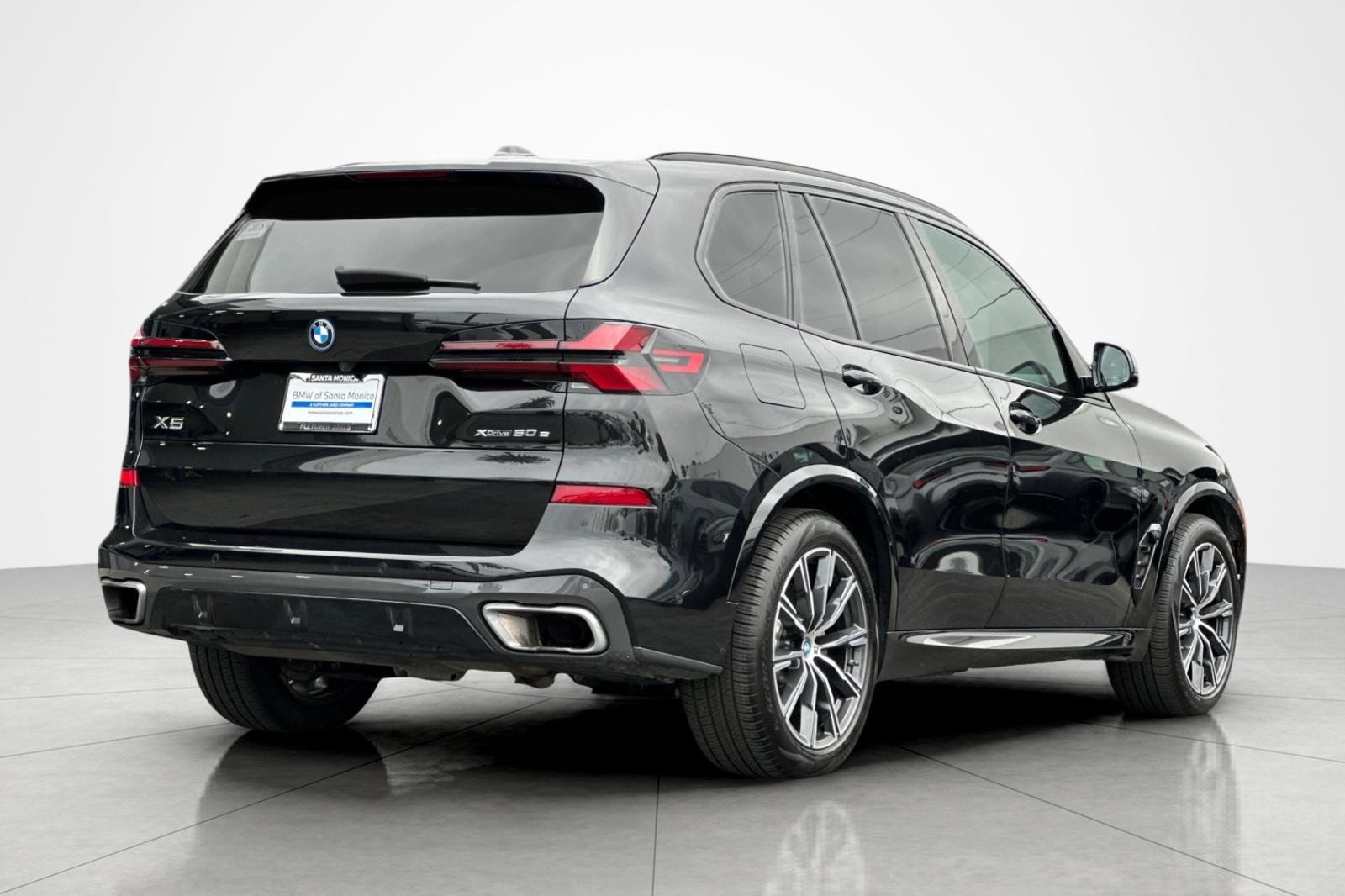 Used 2024 Black Sapphire Metallic BMW xDrive50e image 5
