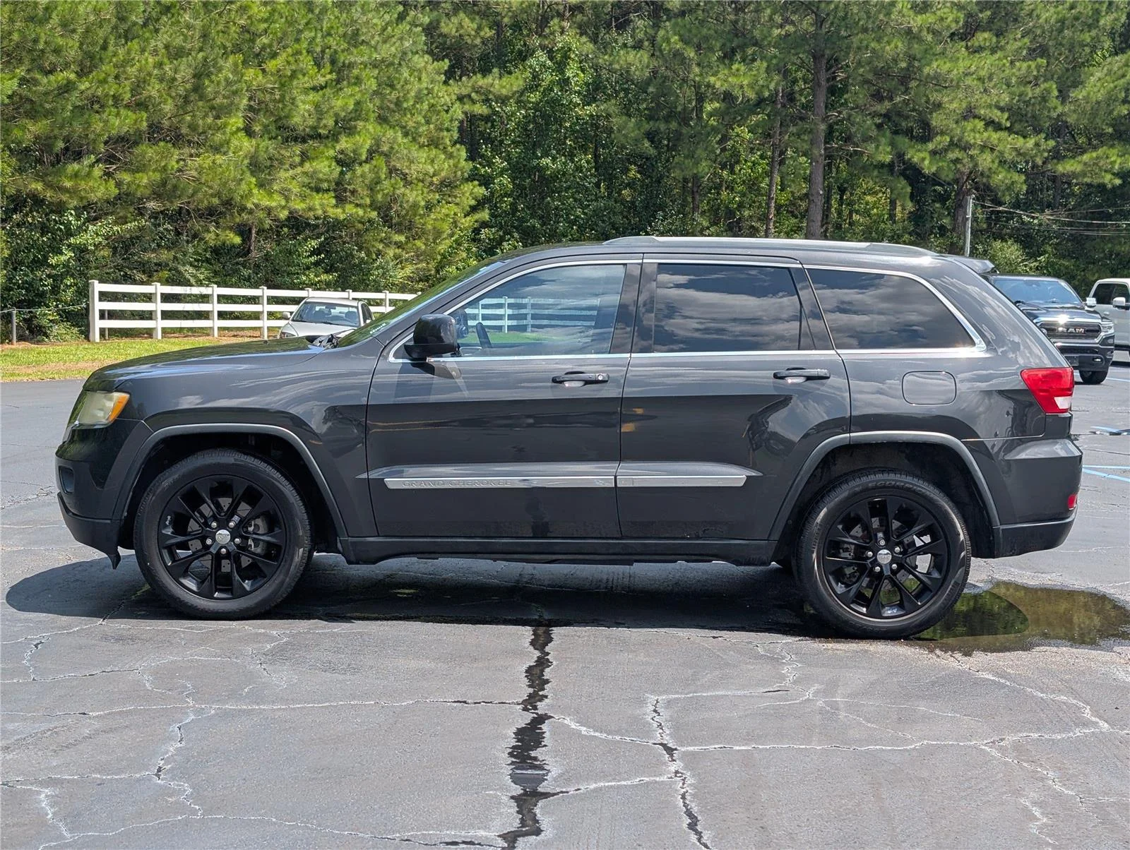 Used 2011 Black Jeep Laredo 2WD image 2