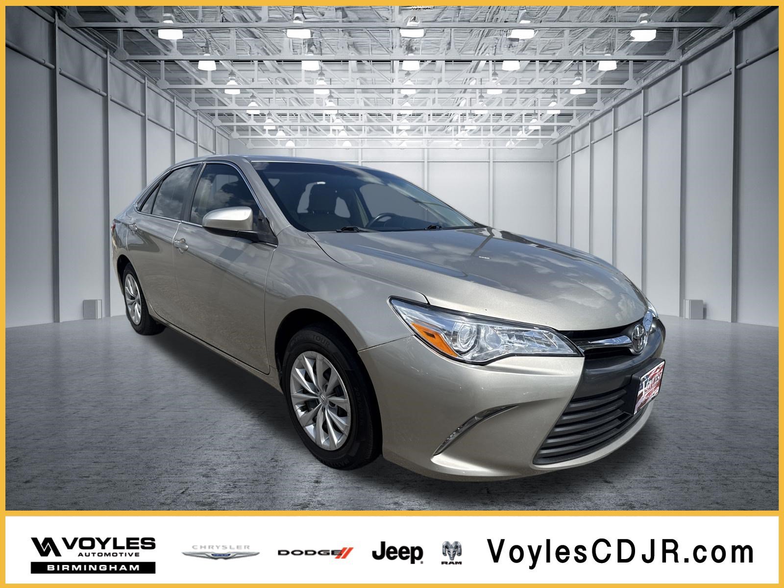 Used 2015 Gold Toyota LE image 1
