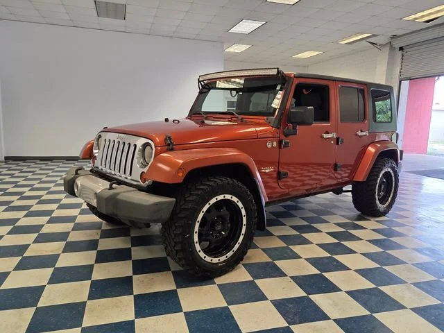 Used 2009 Orange Jeep Unlimited Sahara image 3