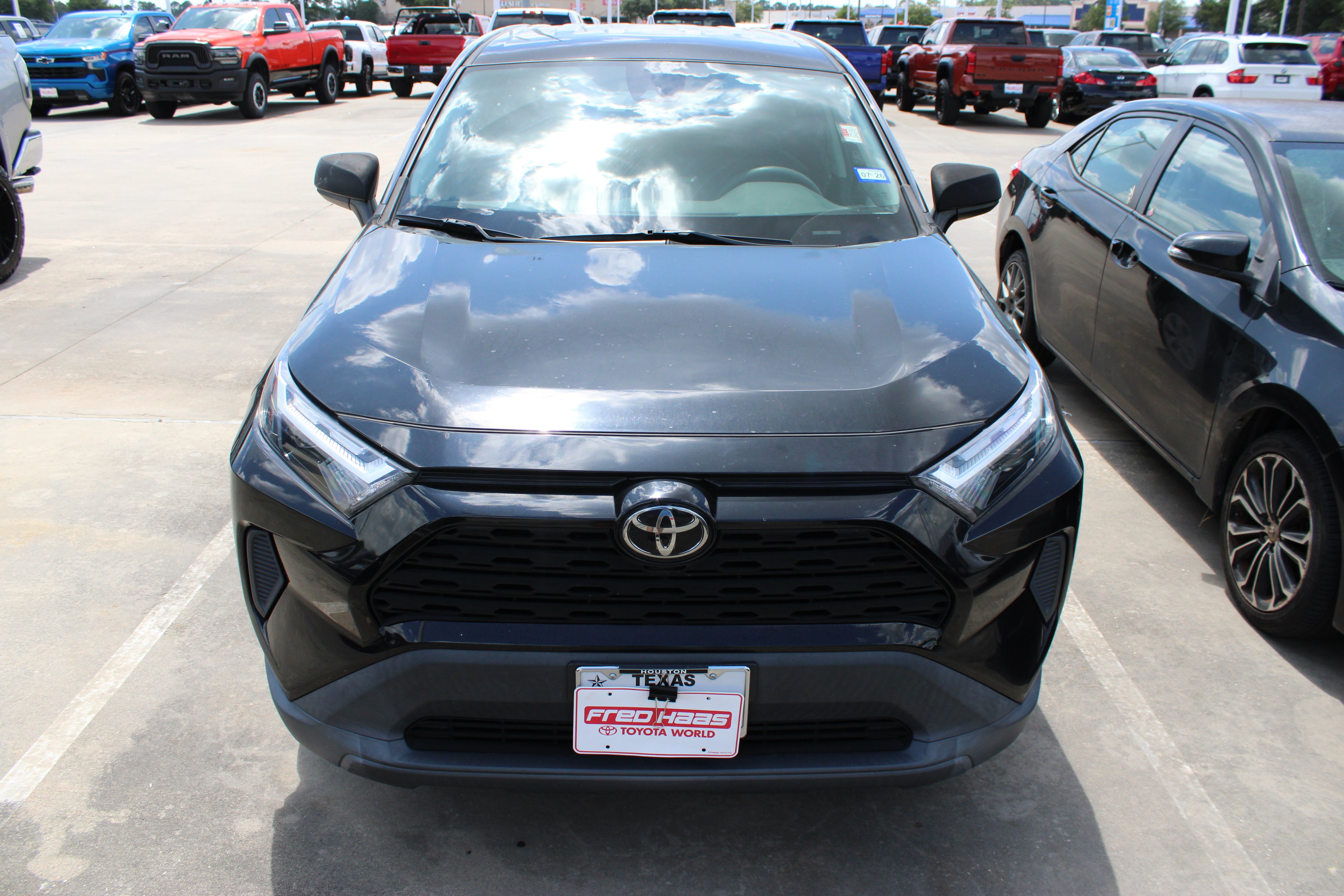 Used 2023 Midnight Black Metallic Toyota LE image 4