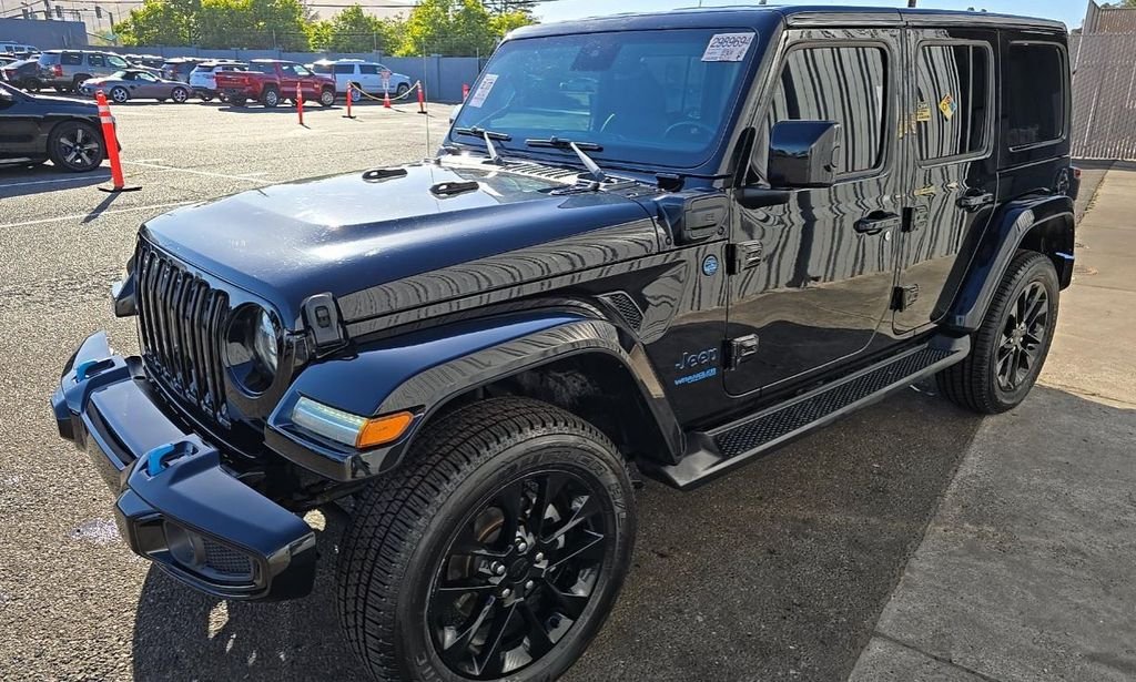 Used 2021 Black Jeep Unlimited Sahara High Altitude 4xe image 1