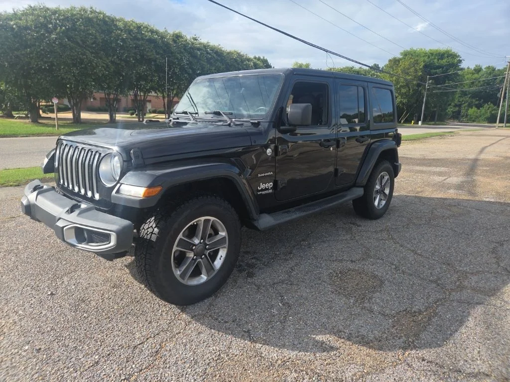 Used 2018 Black Jeep Unlimited Sahara image 5