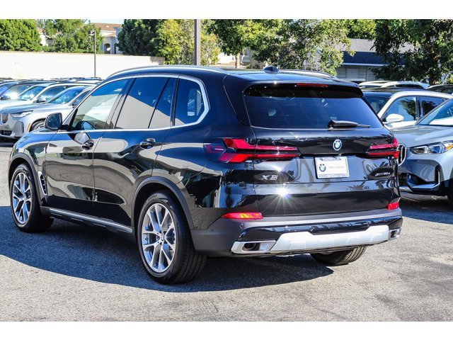 New 2026 Black Sapphire Metallic BMW xDrive50e image 4