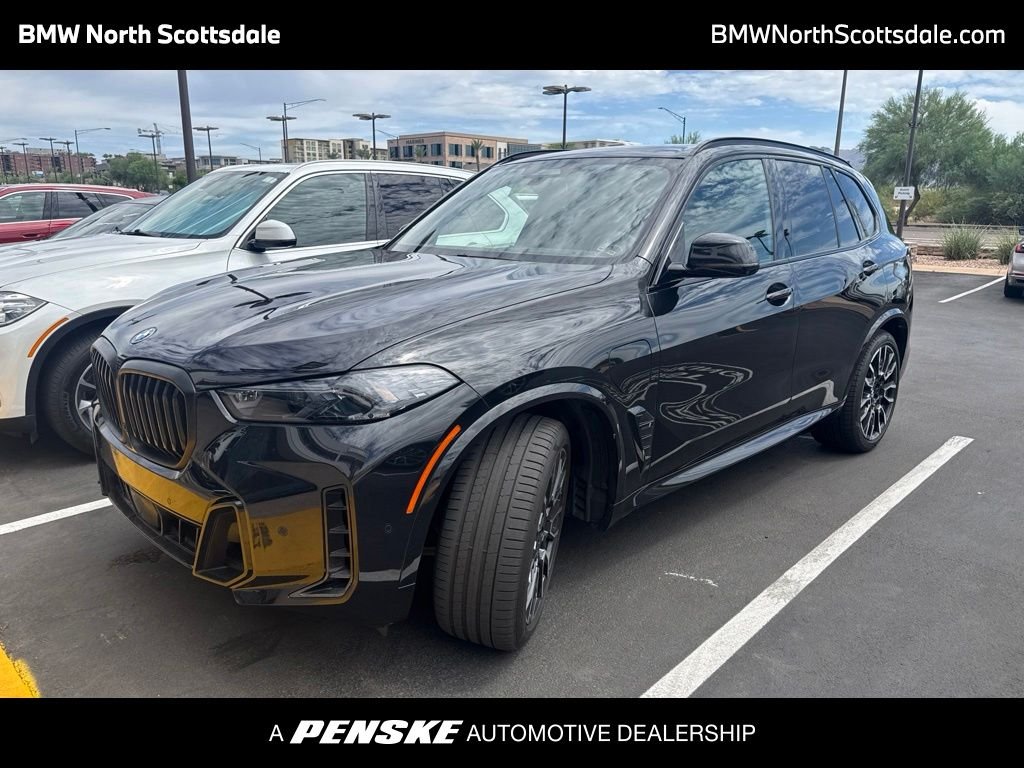 Certified Used 2024 Black Sapphire Metallic BMW xDrive50e image 1