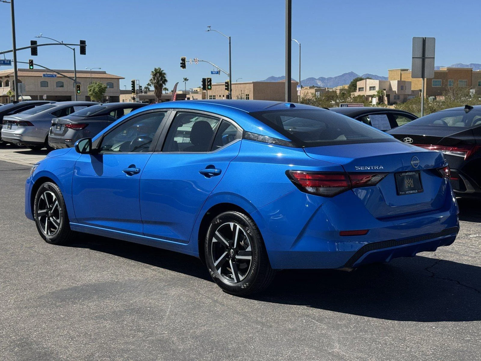 Used 2024 Electric Blue Met Nissan SV image 4
