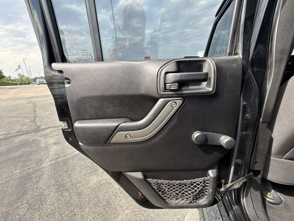 Used 2013 Black Jeep Unlimited Sport image 21