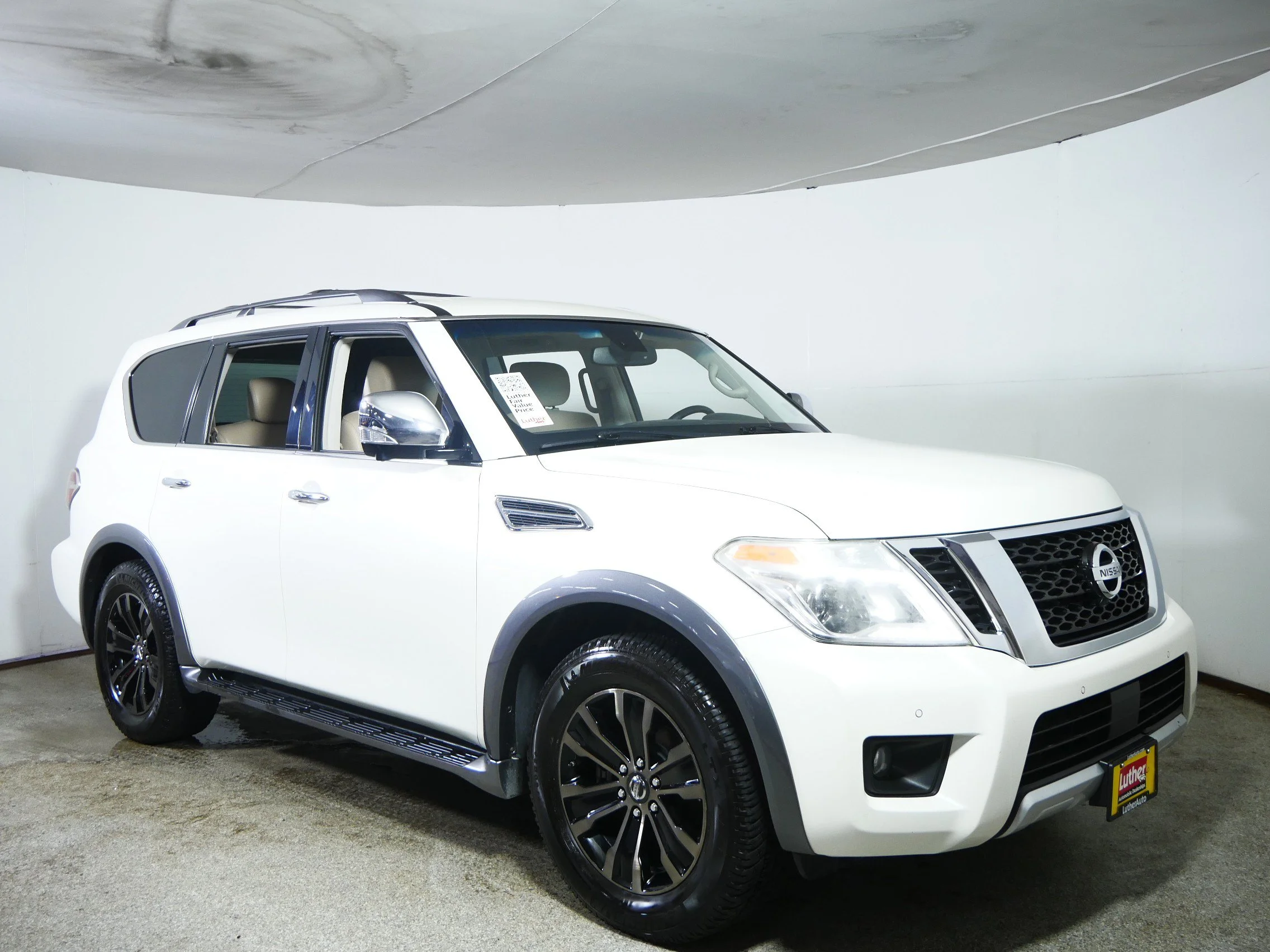 Used 2017 Pearl White Nissan Platinum image 1