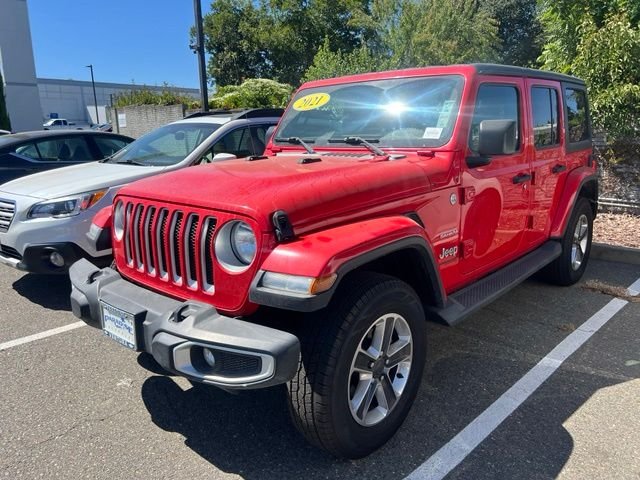 Used 2021 Red Jeep Unlimited Sahara image 1