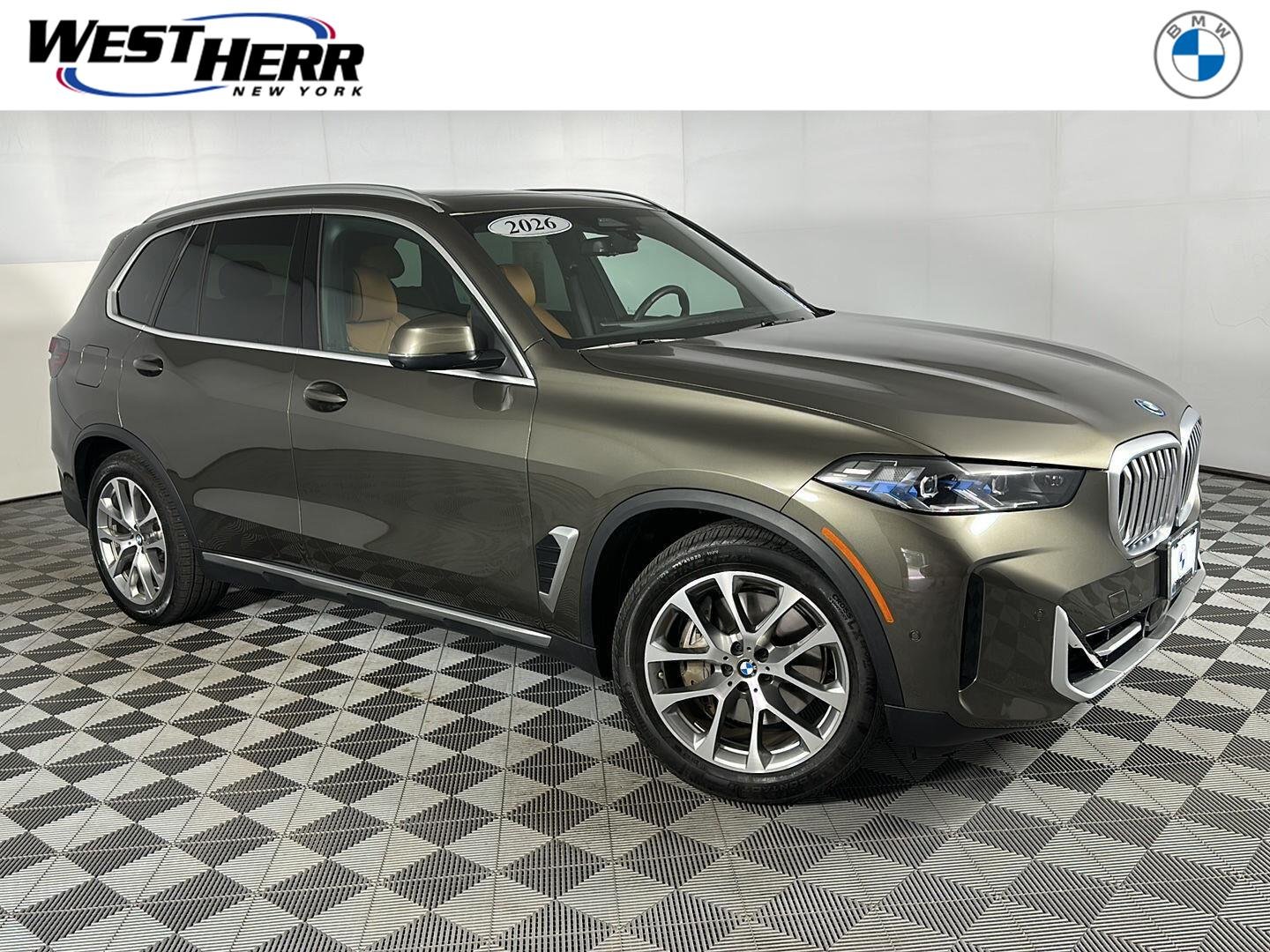 New 2026 Manhattan Green Metallic BMW xDrive50e image 1