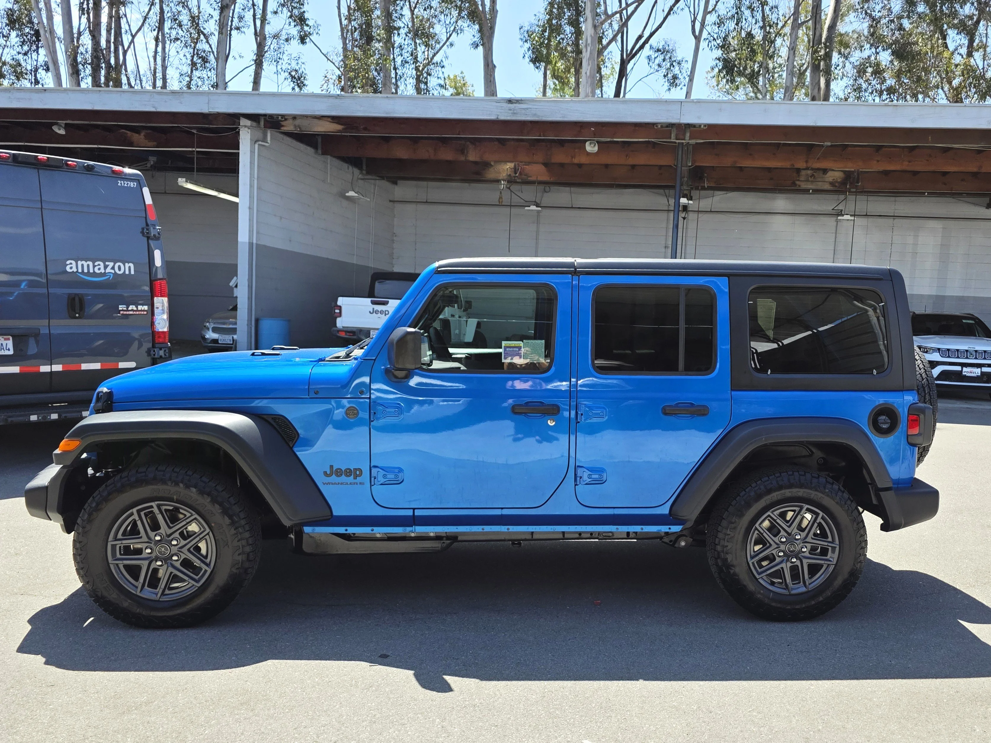 New 2026 Blue Pearl Jeep Sport S image 2