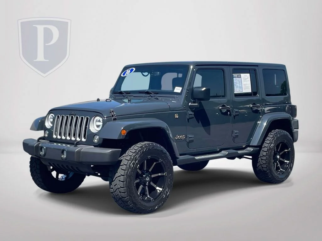 Used 2016 Black Jeep Unlimited Sahara image 4