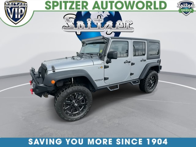 Used 2015 Silver Jeep Unlimited Sport image 4