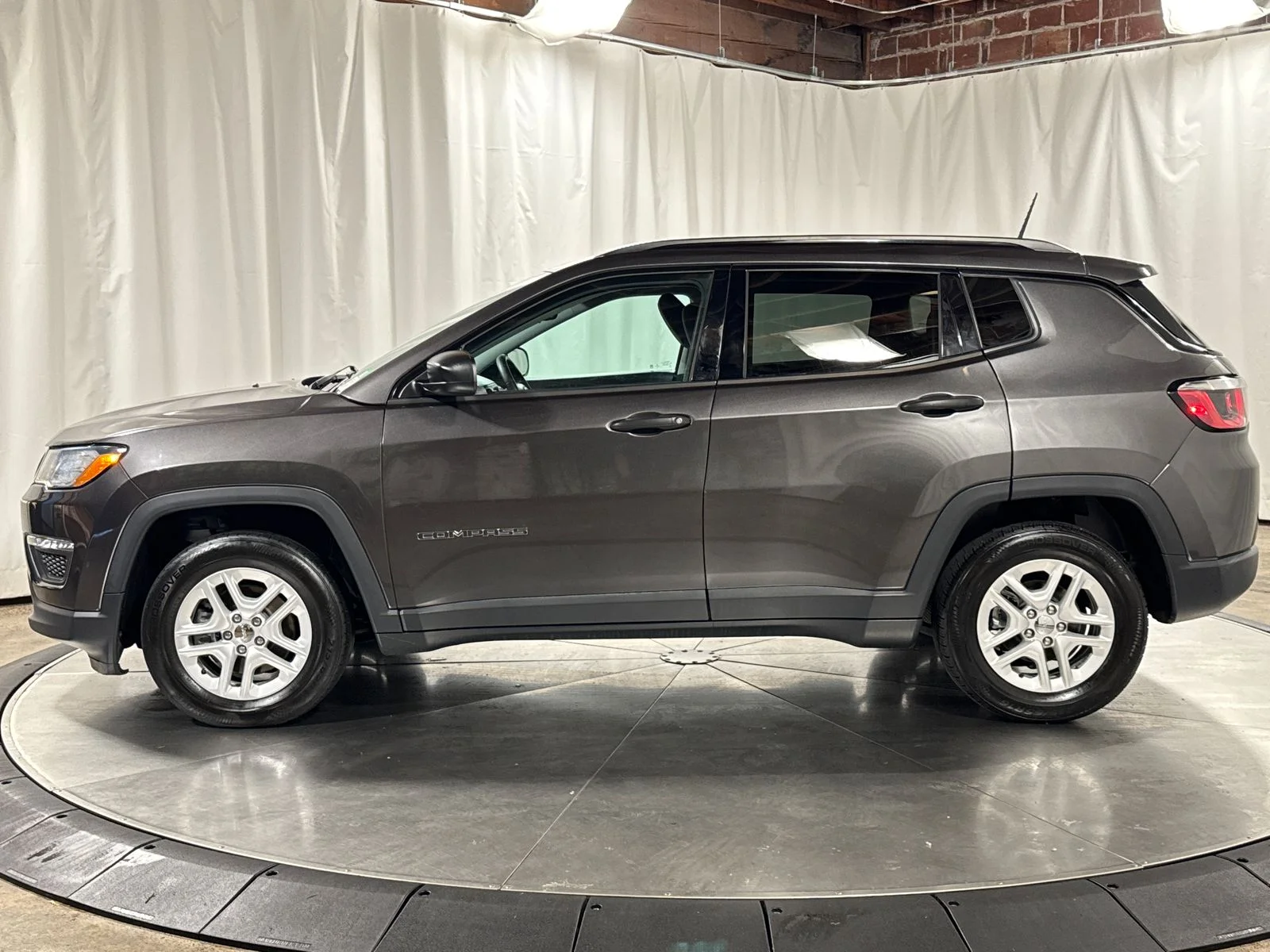 Used 2018 Granite Crystal Metallic Clearcoat Jeep Sport image 8