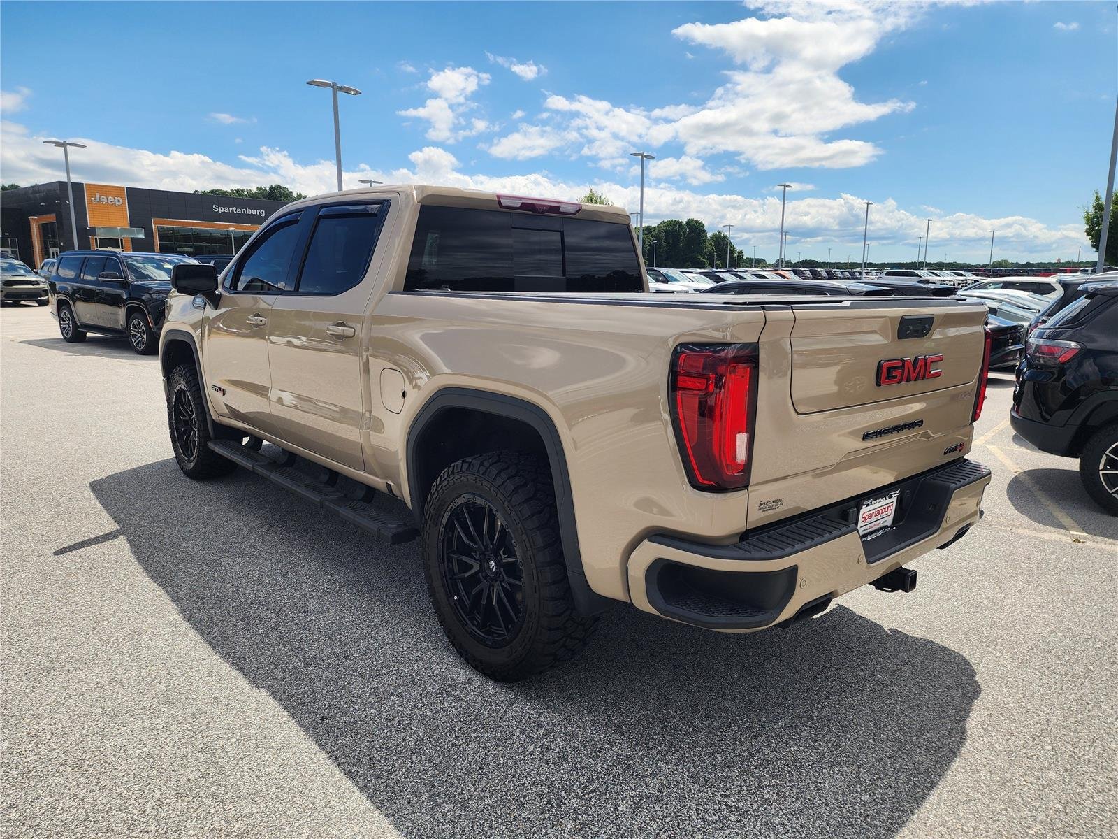 Used 2023 Desert Sand Metallic GMC AT4 image 4
