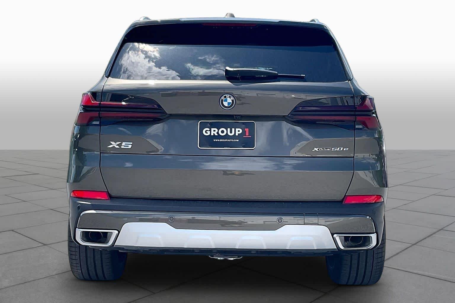 Used 2026 Manhattan Green Metallic BMW xDrive50e image 4