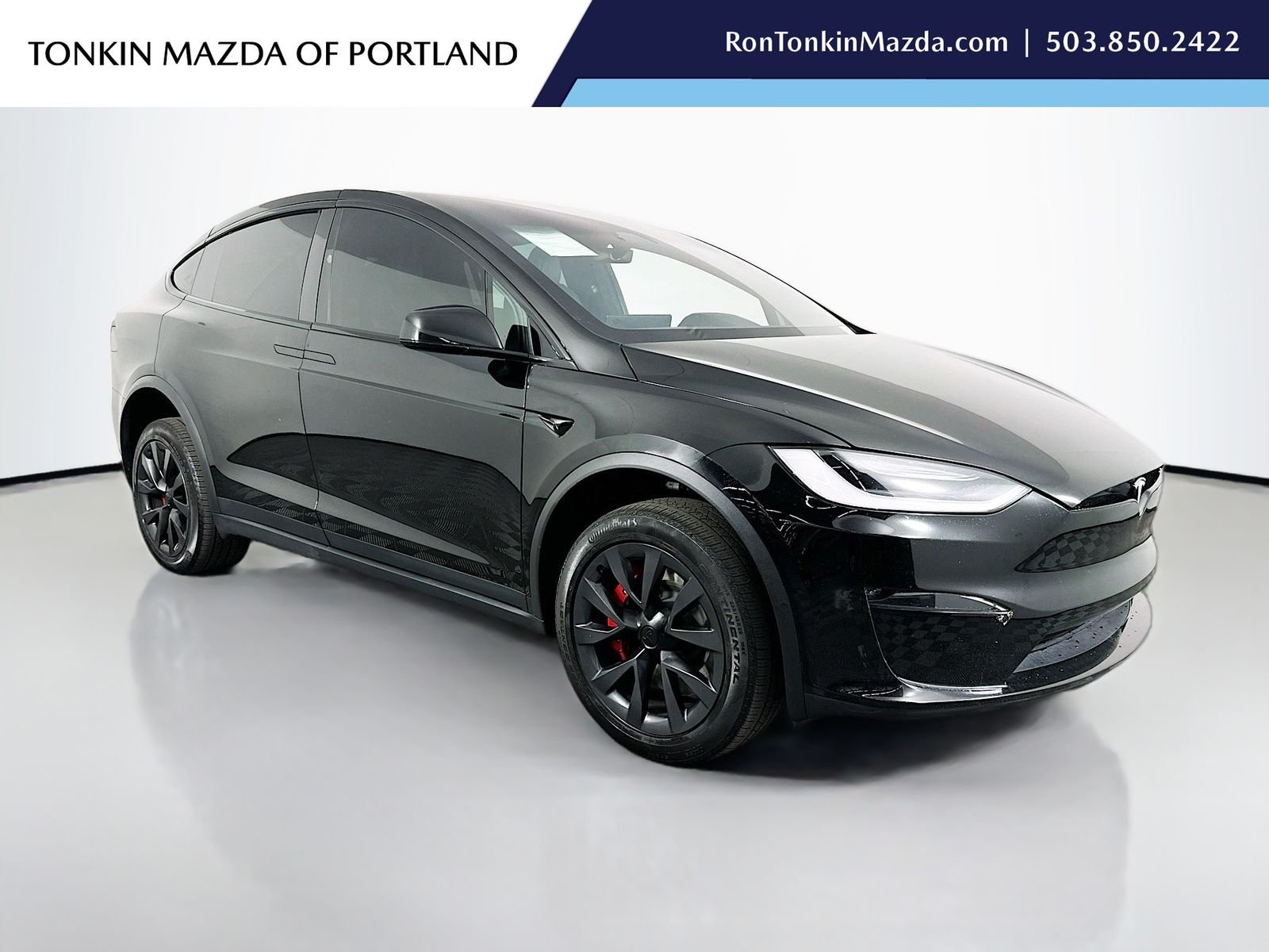 Used 2023 Solid Black Tesla Plaid image 1