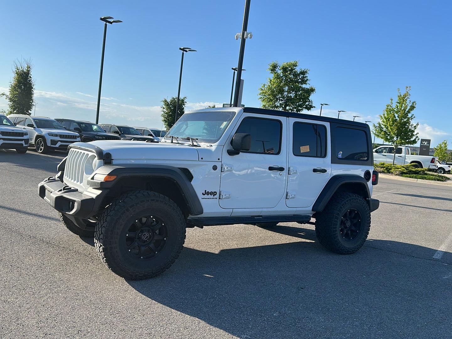 Used 2023 Jeep Wrangler 4-Door Sport S with VIN 1C4HJXDG2PW550114 for sale in Kansas City