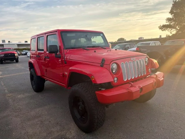 Used 2015 Red Jeep Unlimited Sahara image 4
