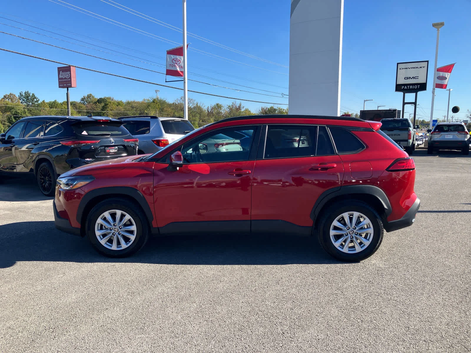 Used 2023 Barcelona Red Metallic Toyota LE image 4
