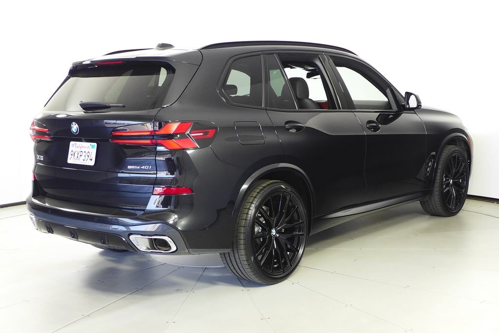 Certified Used 2024 Black Sapphire Metallic BMW sDrive40i image 7