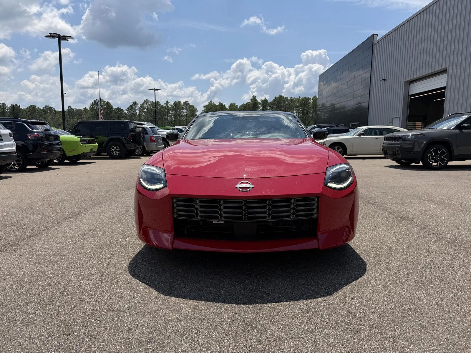 Used 2025 Solid Red/Super Black Nissan Performance image 2
