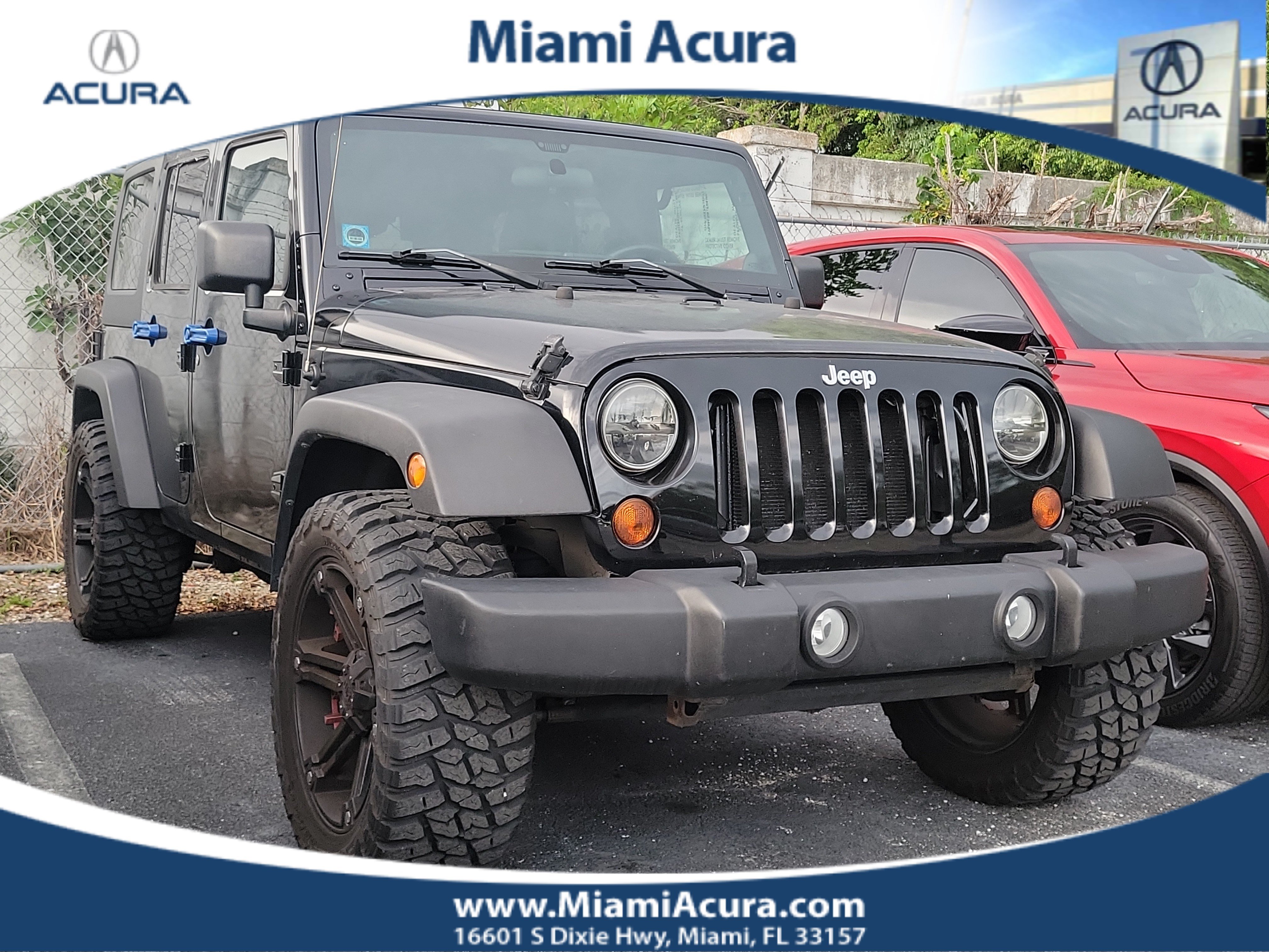 Used 2011 Black ClearCoat Jeep Unlimited Sport image 1