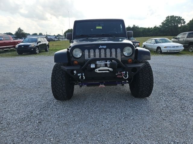 Used 2013 Black Jeep Unlimited Sahara image 3