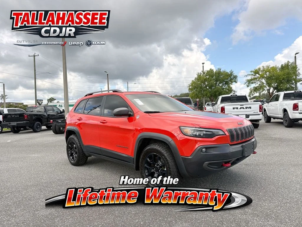 Used 2021 Orange Jeep Trailhawk image 1