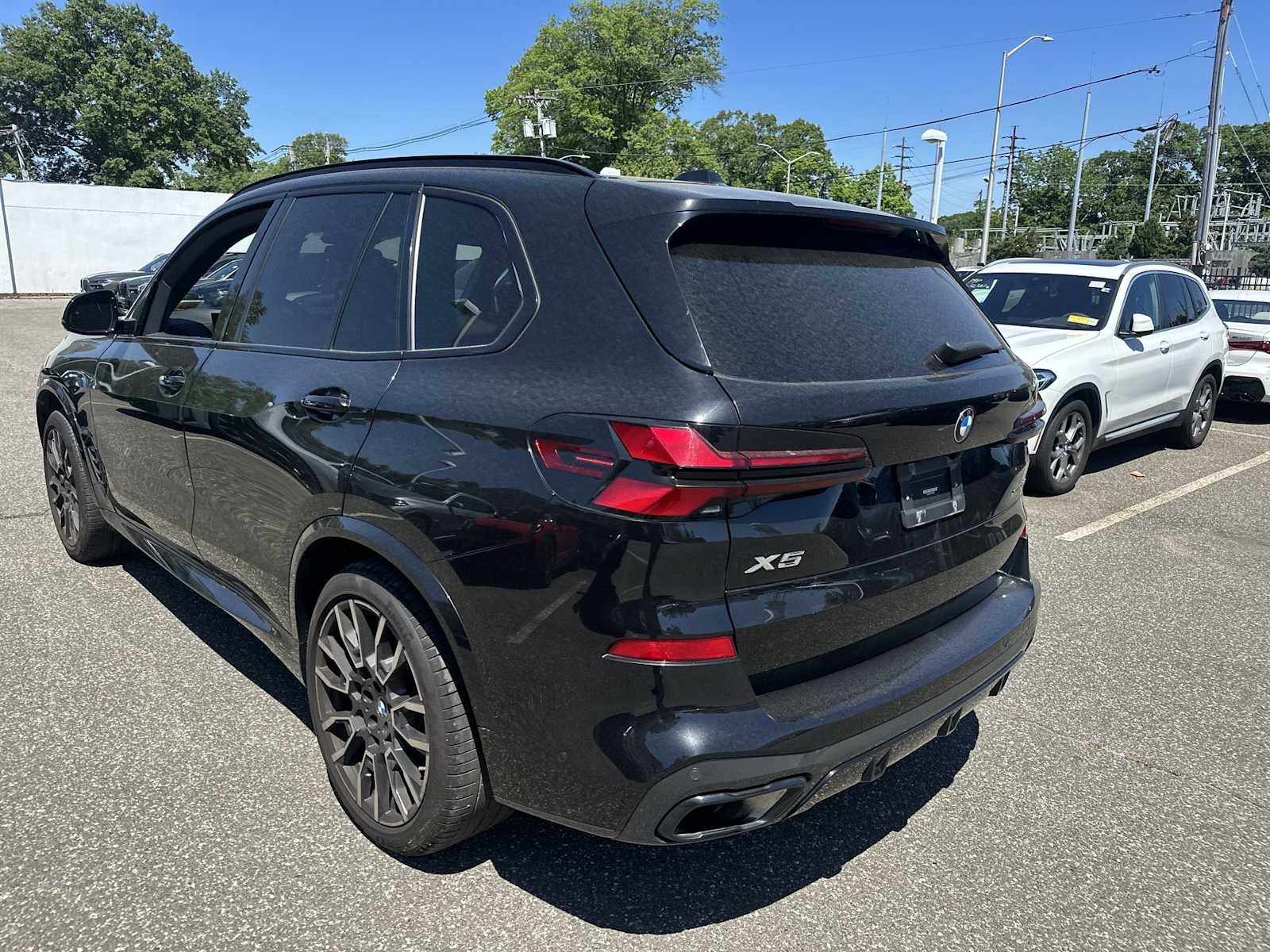 Certified Used 2024 Black Sapphire Metallic BMW xDrive40i image 4