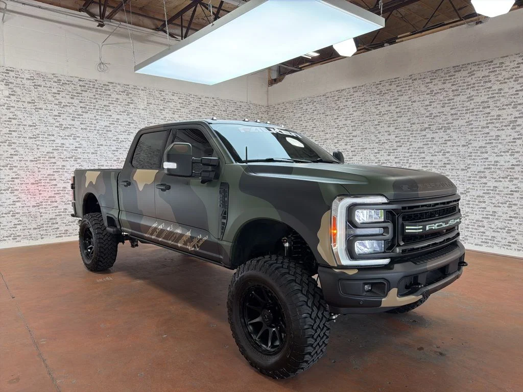 Used 2023 White Metallic / Camo Wrap Ford Lariat image 1