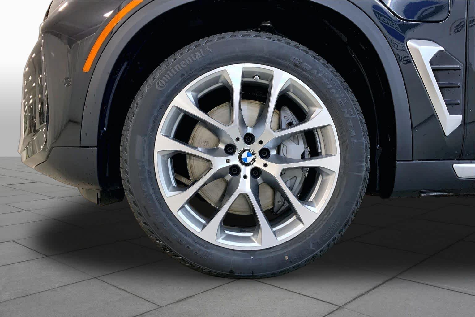 New 2026 Black Sapphire Metallic BMW xDrive50e image 11