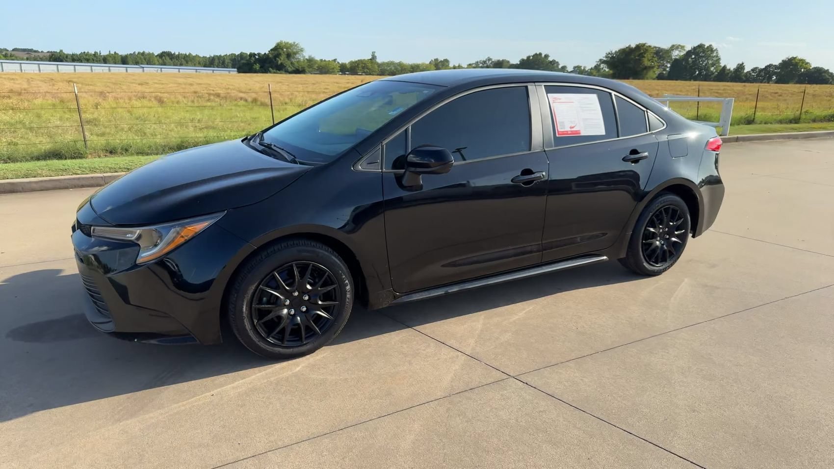 Used 2024 Midnight Black Metallic Toyota LE image 5