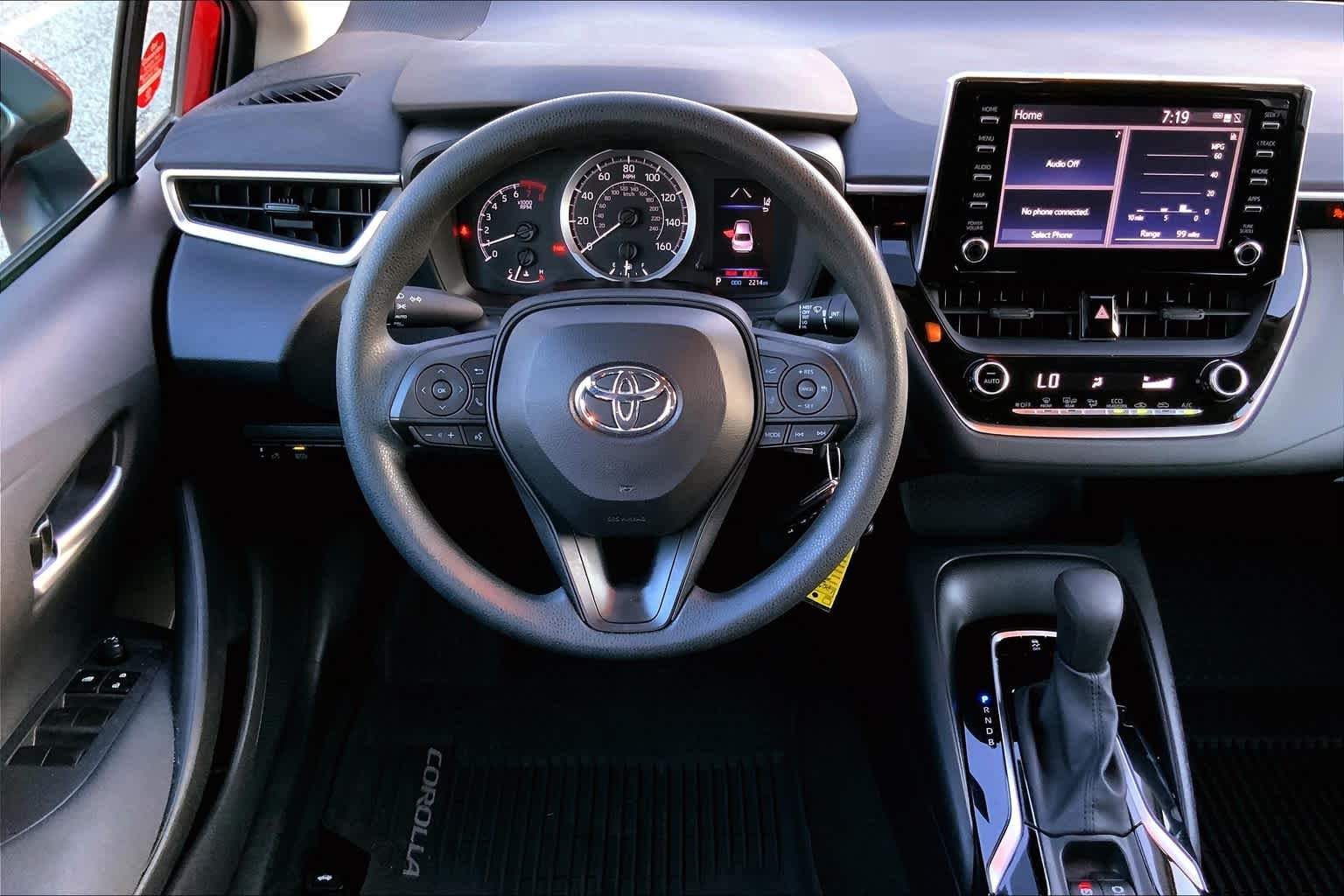 Used 2020 Barcelona Red Metallic Toyota LE image 6