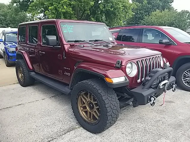Used 2021 Red Jeep Unlimited Sahara image 1