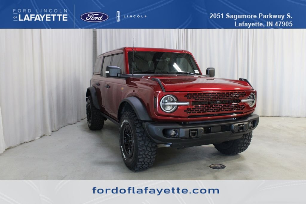 Used 2025 Ruby Red Metallic Ford Badlands image 1