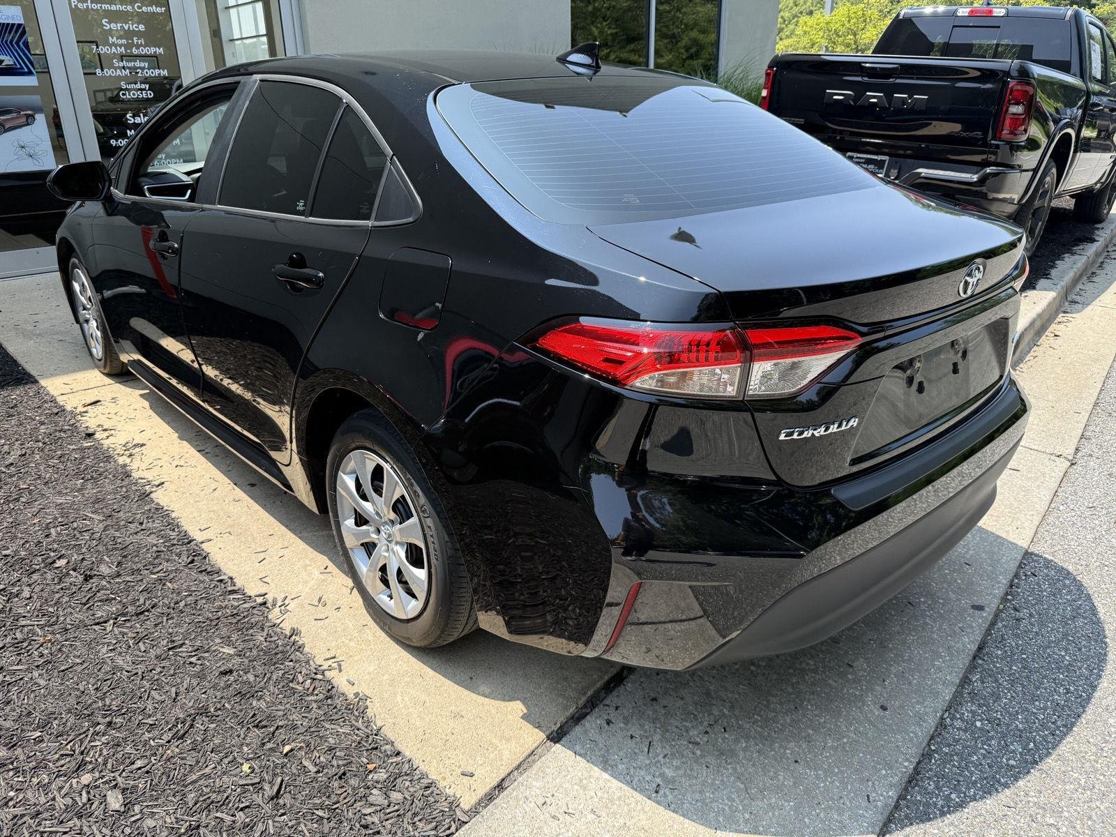 Used 2023 Midnight Black Metallic Toyota LE image 4