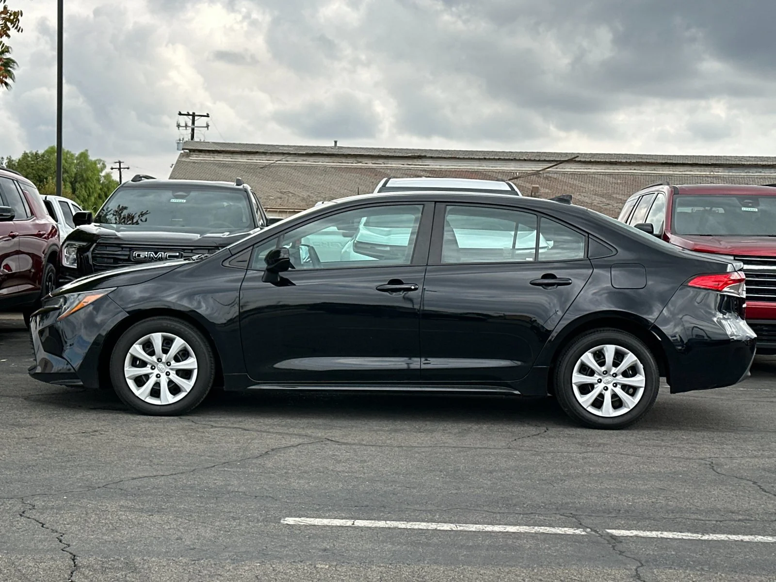 Used 2024 Black Toyota LE image 7